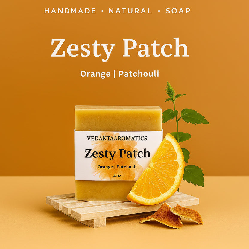 Zesty Patch handmade natural soap with orange and patchouli on a wooden platform against an orange background.